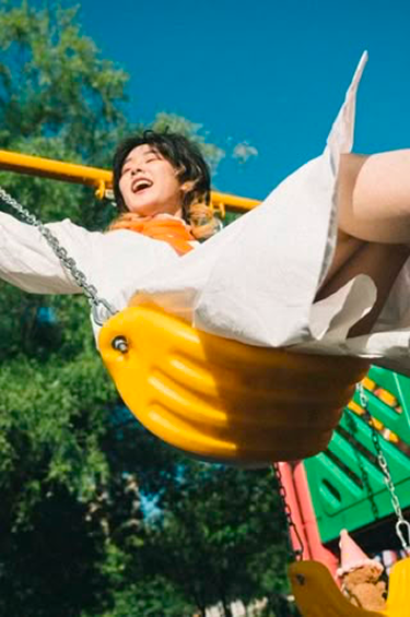 Happy Child On Swing